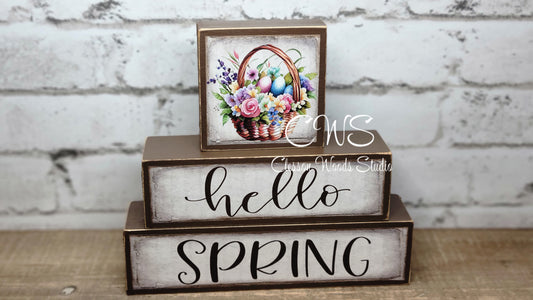 Hello Spring Basket of Flowers and Colored Eggs Brown Wood Block Stack