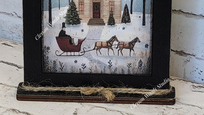 Jingle All The Way Saltbox House and Sleigh Framed Art with Attached Stand