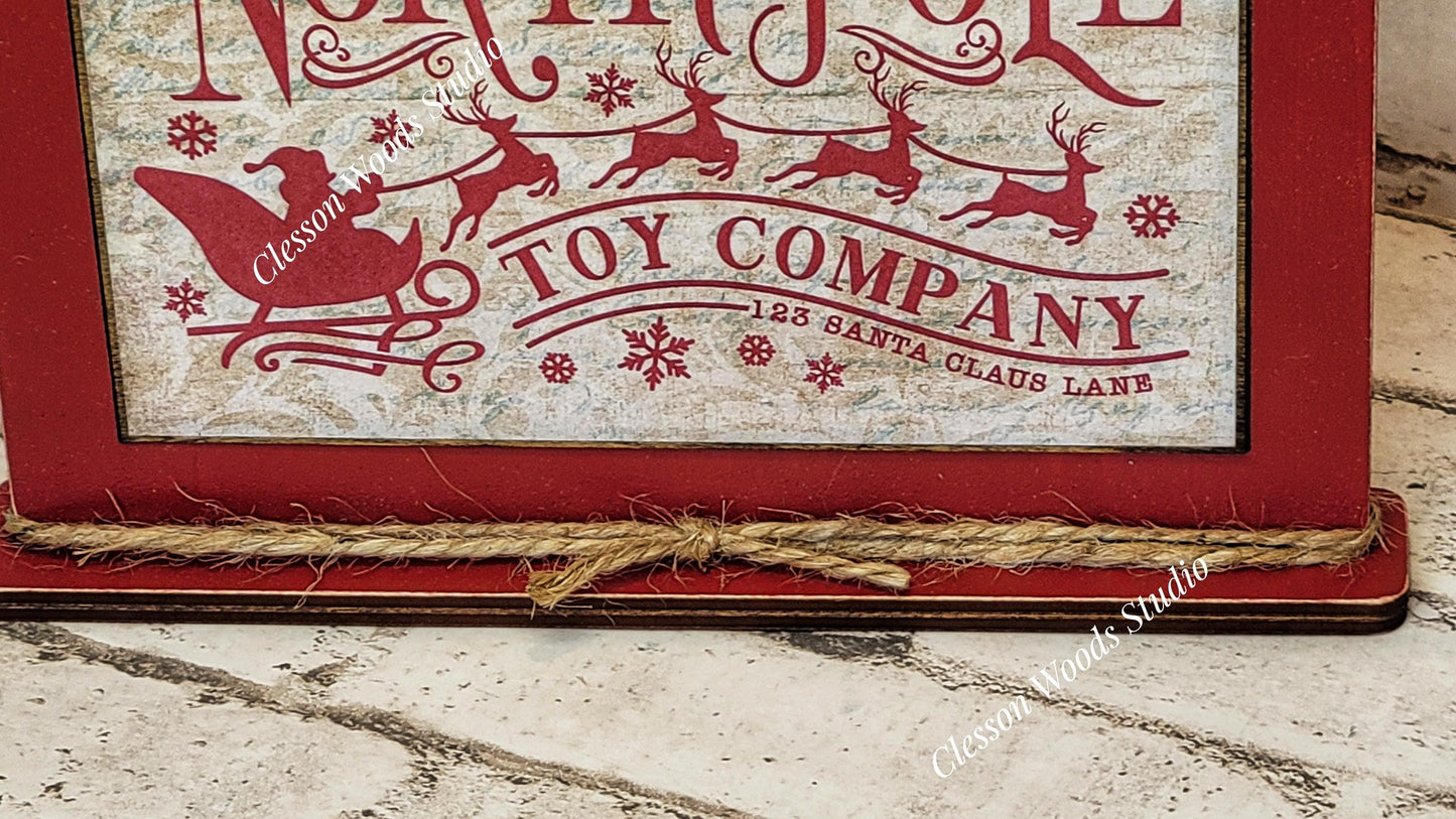 North Pole Toy Company Framed Art with Attached Stand