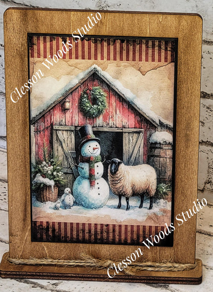 Primitive Winter Barn Snowman and Sheep Framed Art with Attached Stand