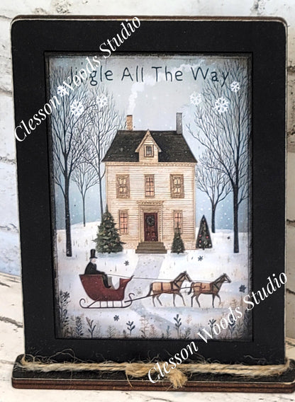 Jingle All The Way Saltbox House and Sleigh Framed Art with Attached Stand
