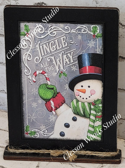 Jingle All The Way Snowman With Candy Cane Framed Art with Attached Stand