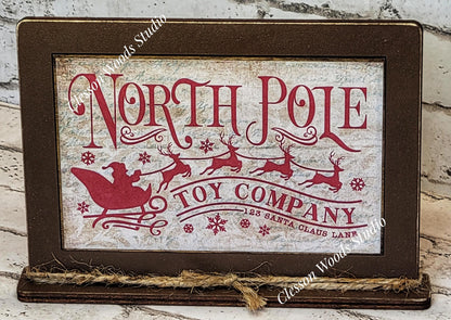 North Pole Toy Company Framed Art with Attached Stand