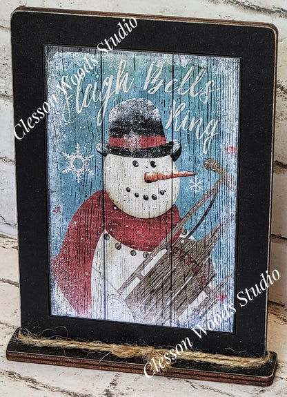 Primitive Snowman Sleigh Bells Ring Framed Art with Attached Stand