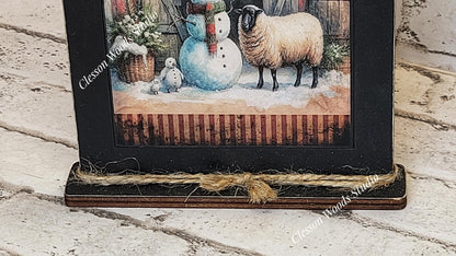 Primitive Winter Barn Snowman and Sheep Framed Art with Attached Stand