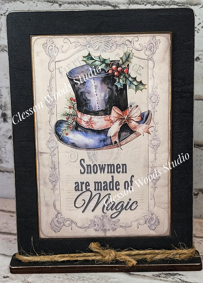 Rustic Winter Snowmen Are Made of Magic Framed Art with Attached Stand