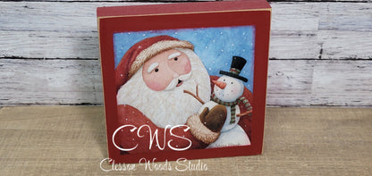 Santa Holding Snowman Square Wood Sign